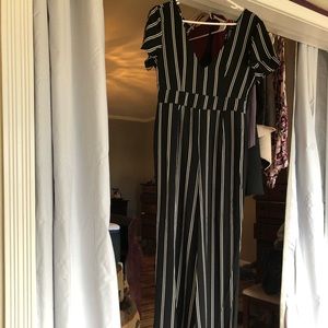 Black &  white stripe jump suit . Great condition.